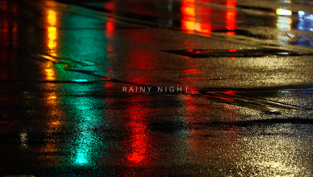 Colourful lights on wet pavement