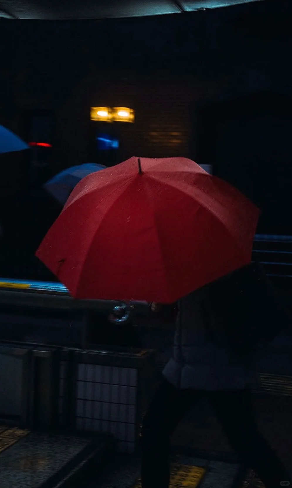 A red umbrella at night
